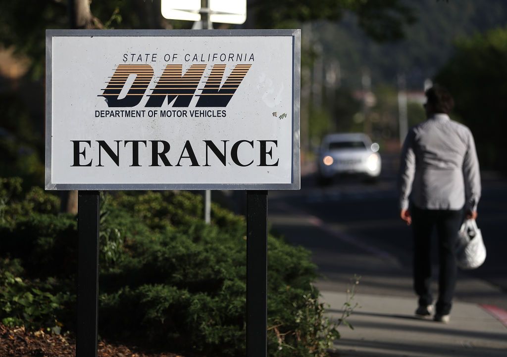 A DMV entrance sign.