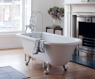 freestanding bath in bathroom with fireplace