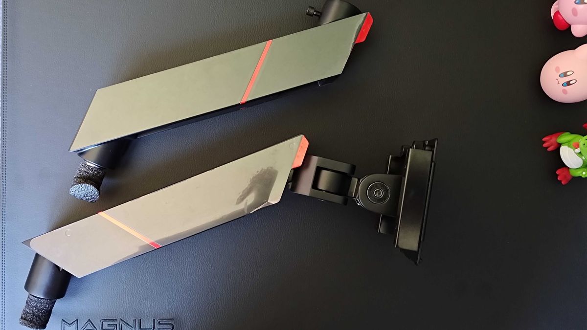 Secretlab Heavy Duty Monitor arm sections sitting on Magnus Pro desk