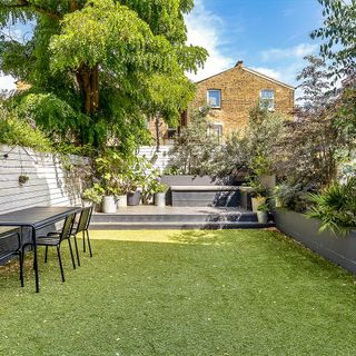 garden area with lawn and table