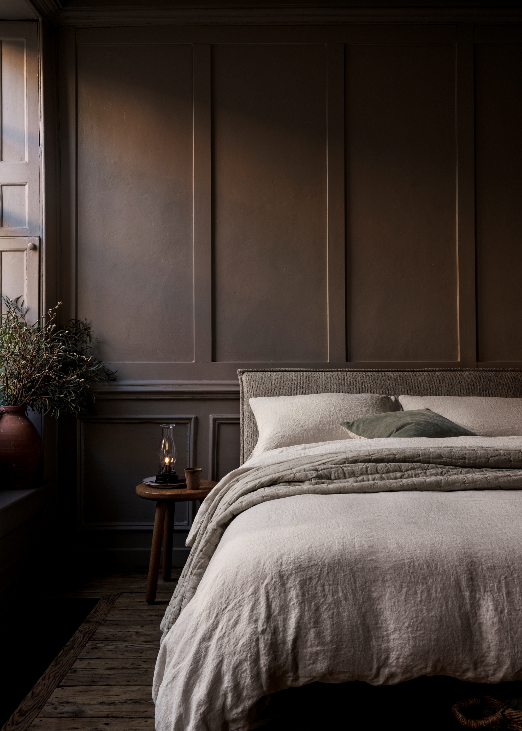 A dark bedroom with natural hemp bedding from Naturalmat