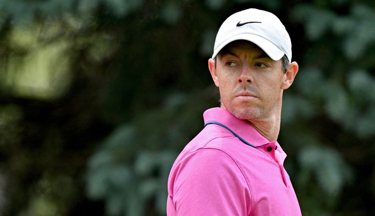Rory stares on as he walks to the next tee