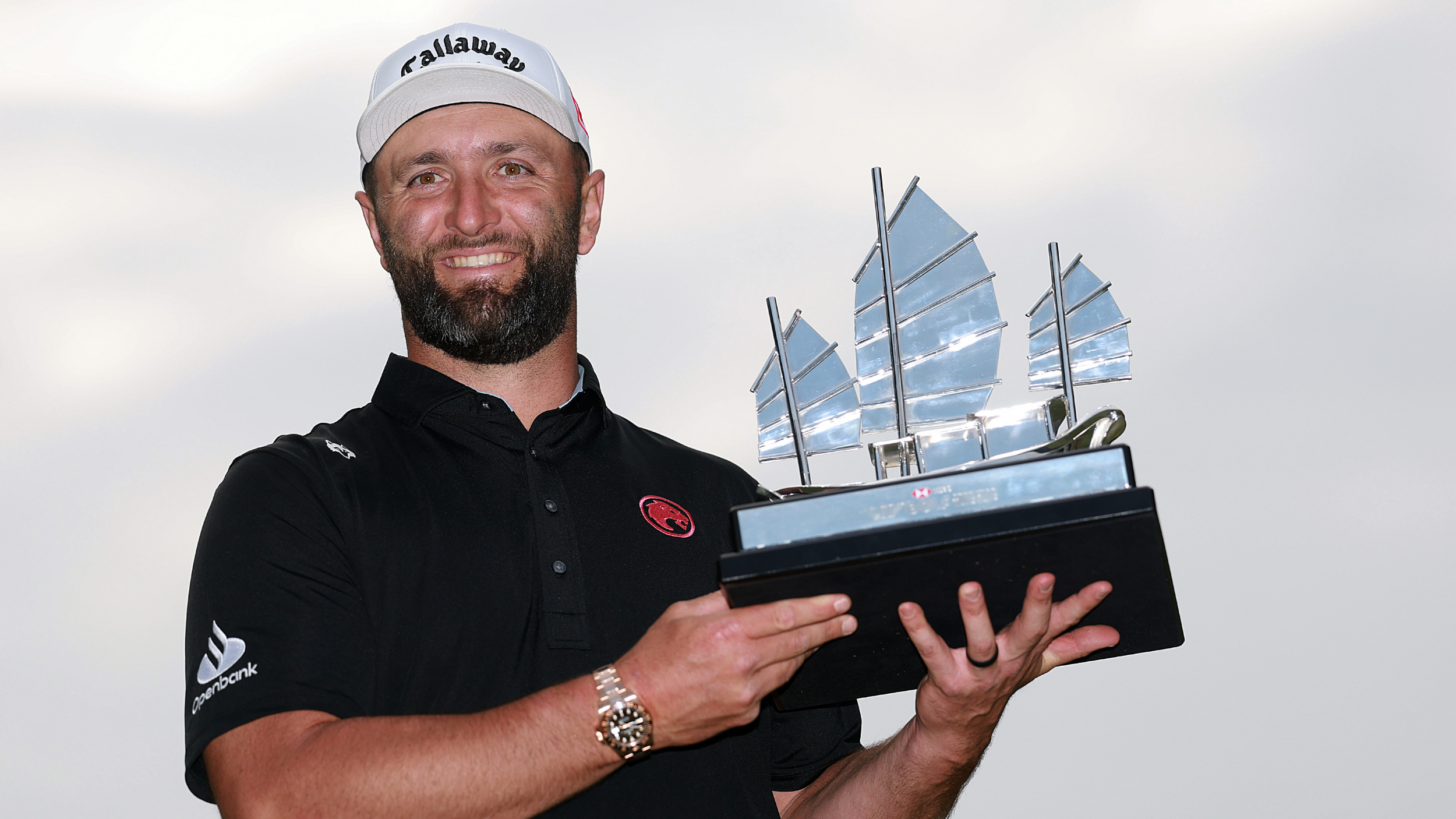 Jon Rahm holding the LIV Golf Hong Kong trophy