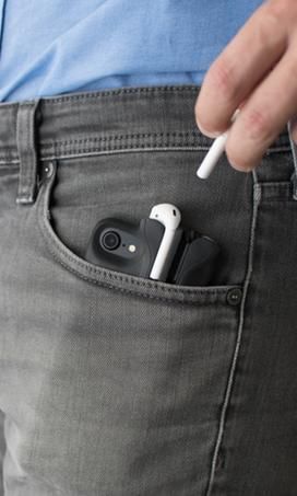 The PodCase is shown in a jeans pocket, with a hand reaching down to pull out one of the AirPods nestled therein