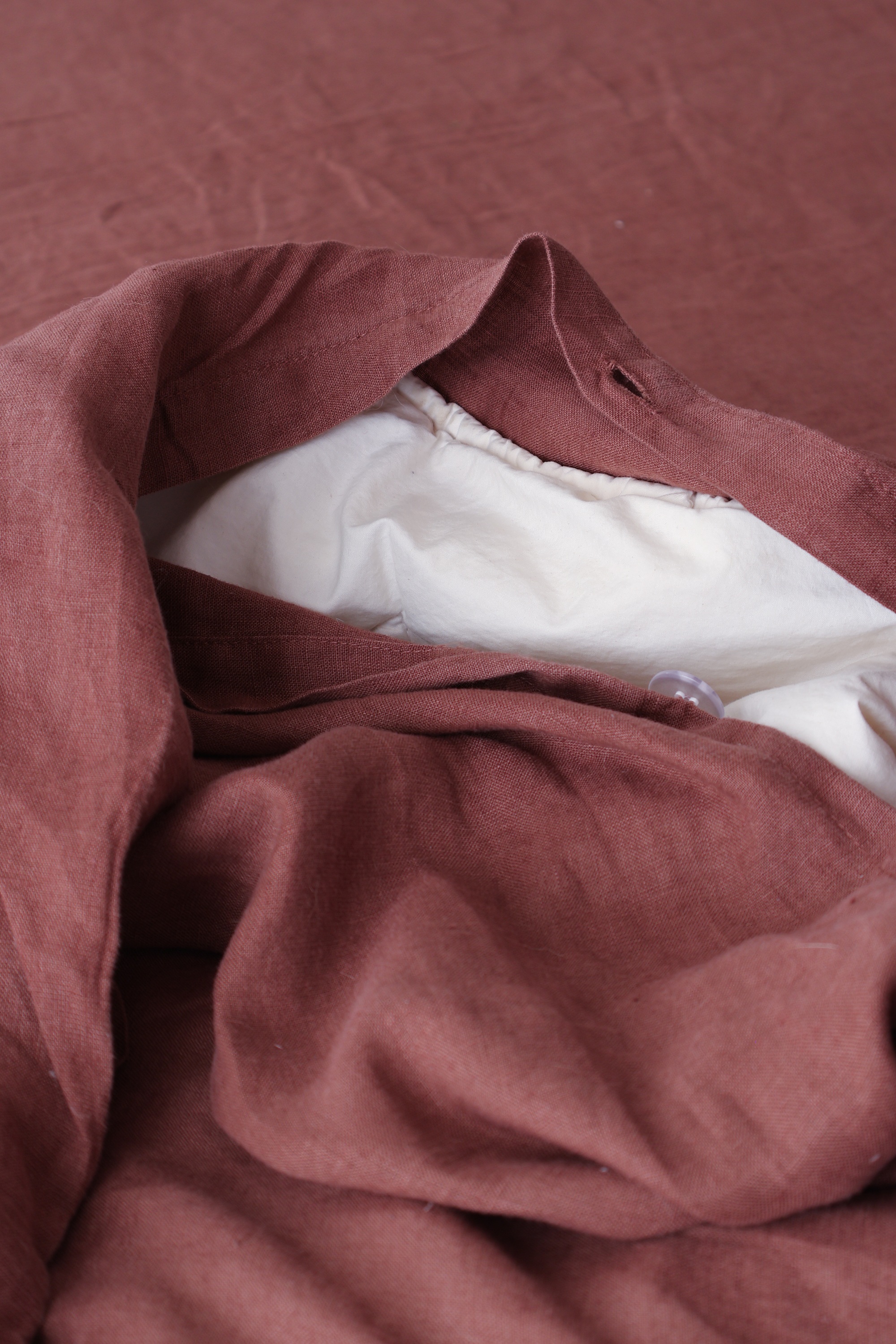 M&s red linen bedding on a bed in a bedroom