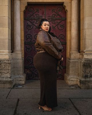 french woman wearing brown leather jacket outfit