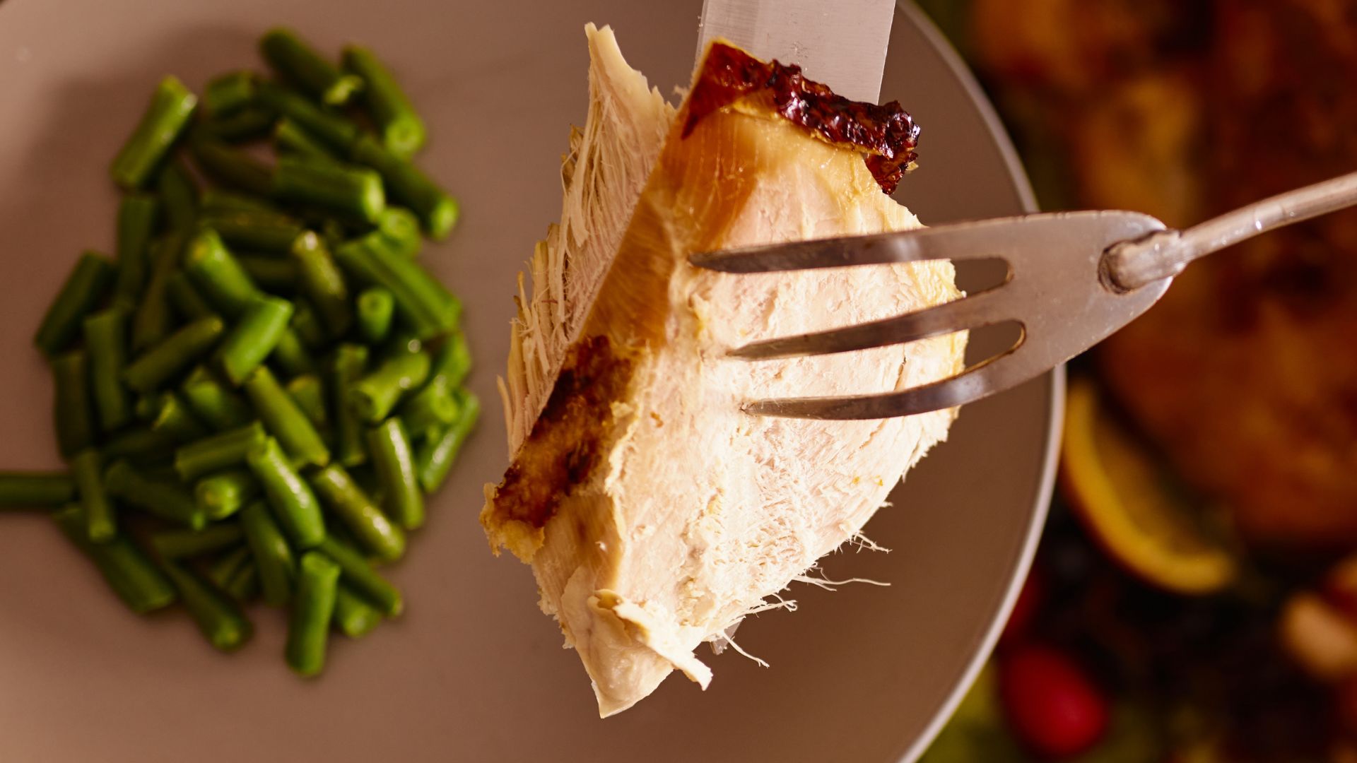 Turkey with green beans on plate