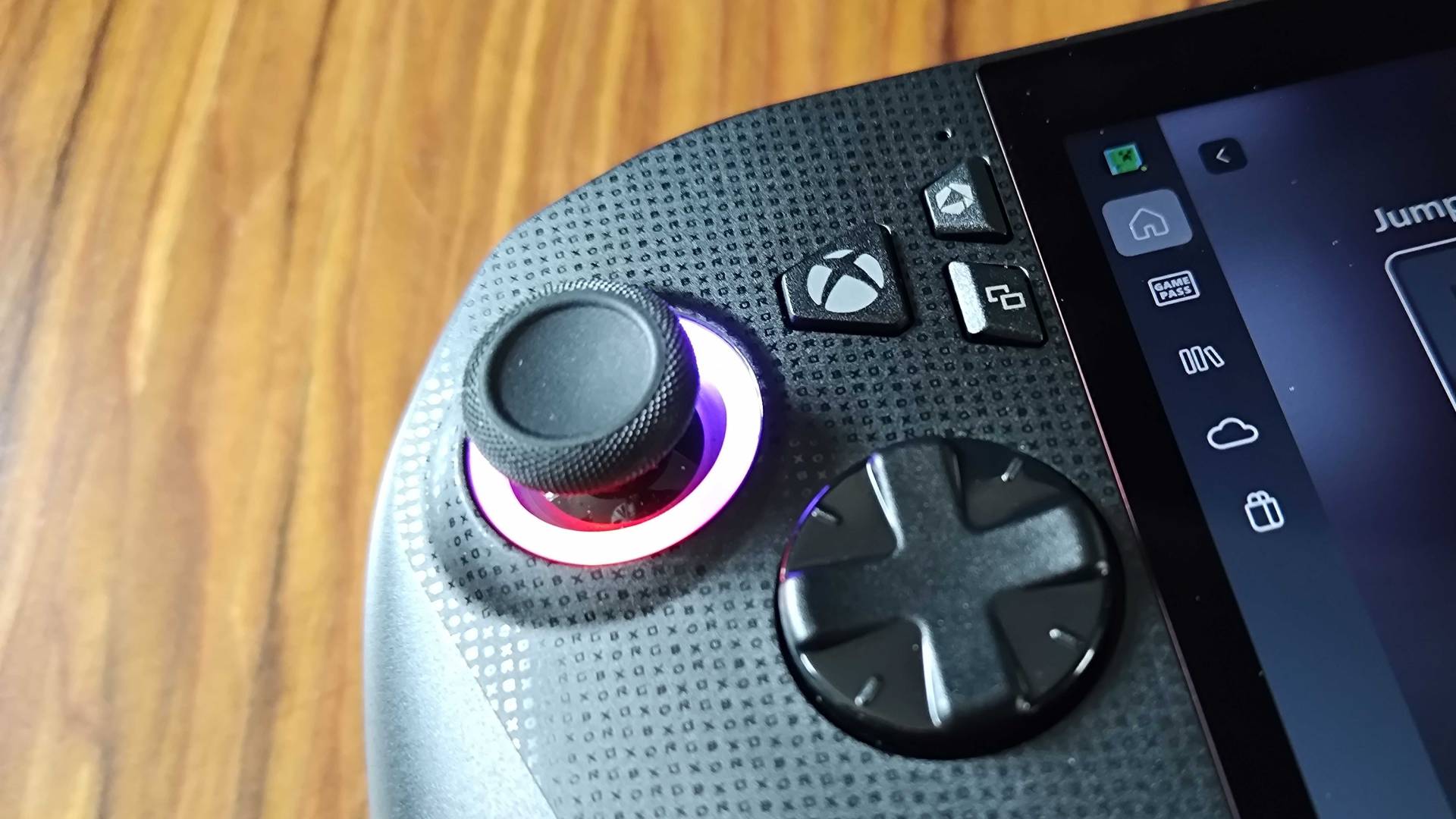 Close up of left side of ROG Xbox Ally X with d-pad, left thumb stick, and menu buttons in view.
