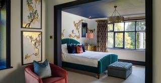 bedroom with a dark blue ceiling to show a cocooning best color for ceilings