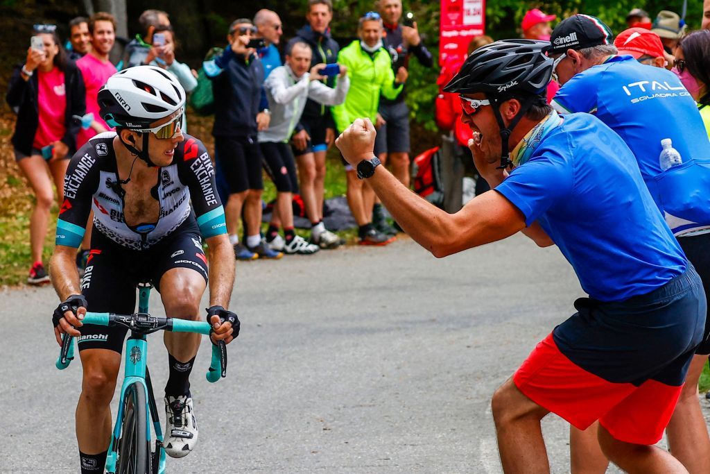 Spectators cheer as Team BikeExchange rider Great Britains Simon Yates rides in the final ascent on his way to win the 19th stage of the Giro dItalia 2021 cycling race 166km between Abbiategrasso and Alpe di Mera on May 28 2021 Photo by Luca BETTINI POOL AFP Photo by LUCA BETTINIPOOLAFP via Getty Images