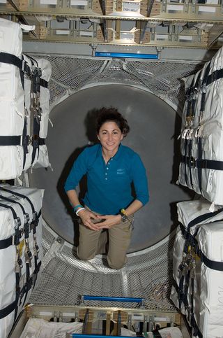 NASA astronaut Nicole Stott floats inside the European Space Agency's Automated Transfer Vehicle-2 cargo spacecraft while it is docked to the International Space Station in March 2011.