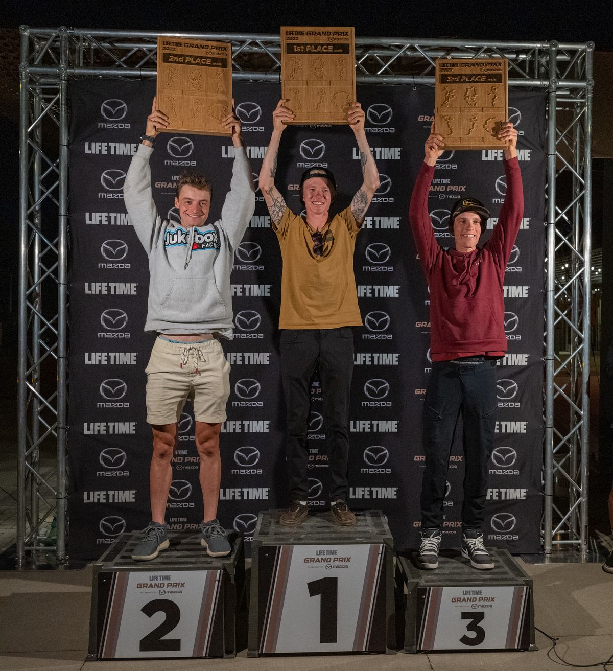 Men's overall podium in 2022 Life Time Grand Prix (L to R): runner-up Alexey Vermeulen, winner Keegan Swenson, third-placed Russell Finsterwald