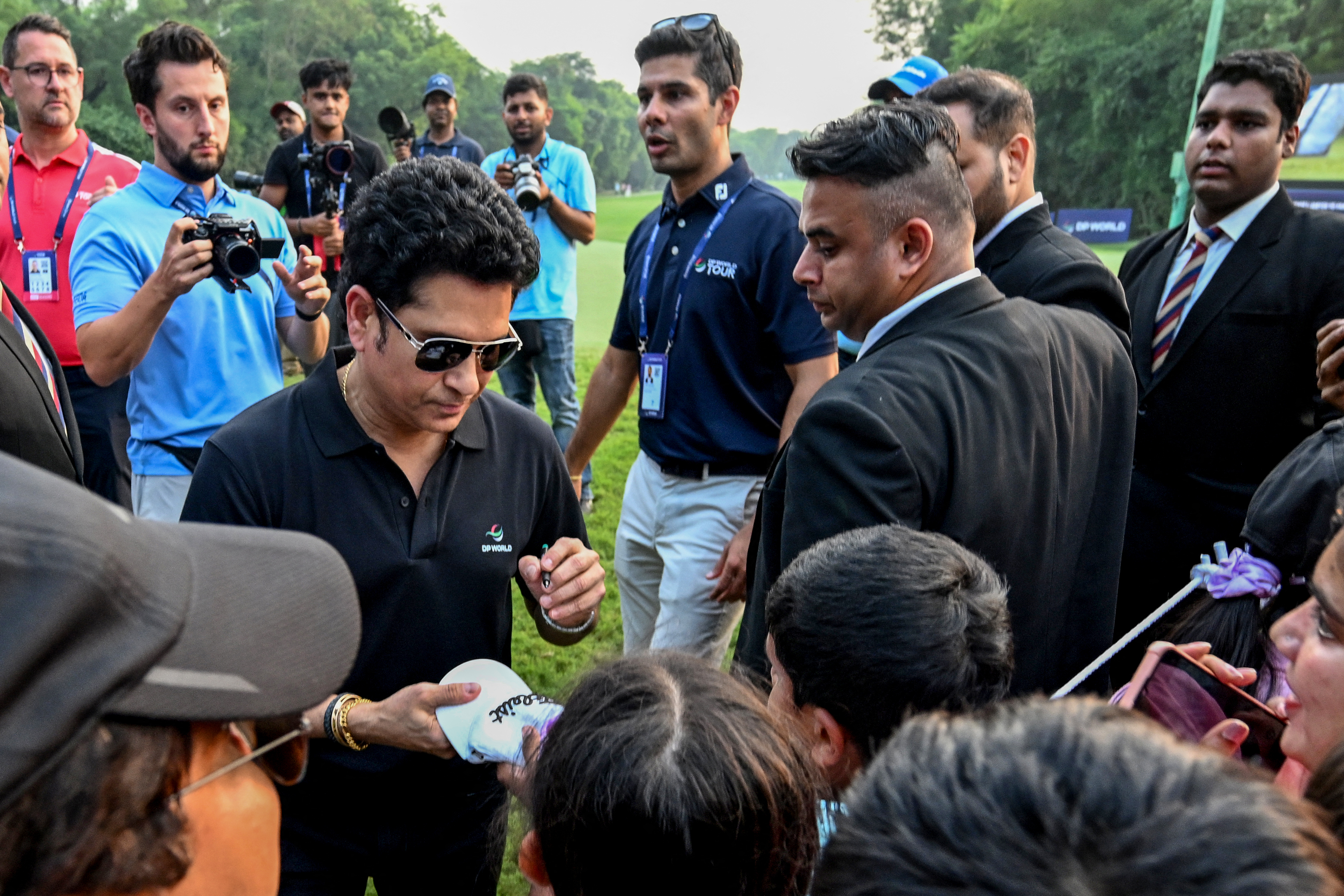 Sachin Tendulkar signs autographs during the DP World India Championship