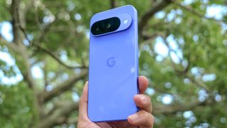 Google Pixel 10 in the hand.
