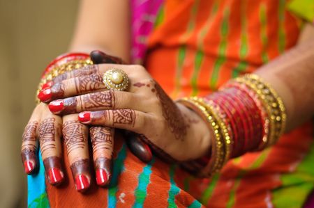 Woman's Hands With Henna And Jewelry