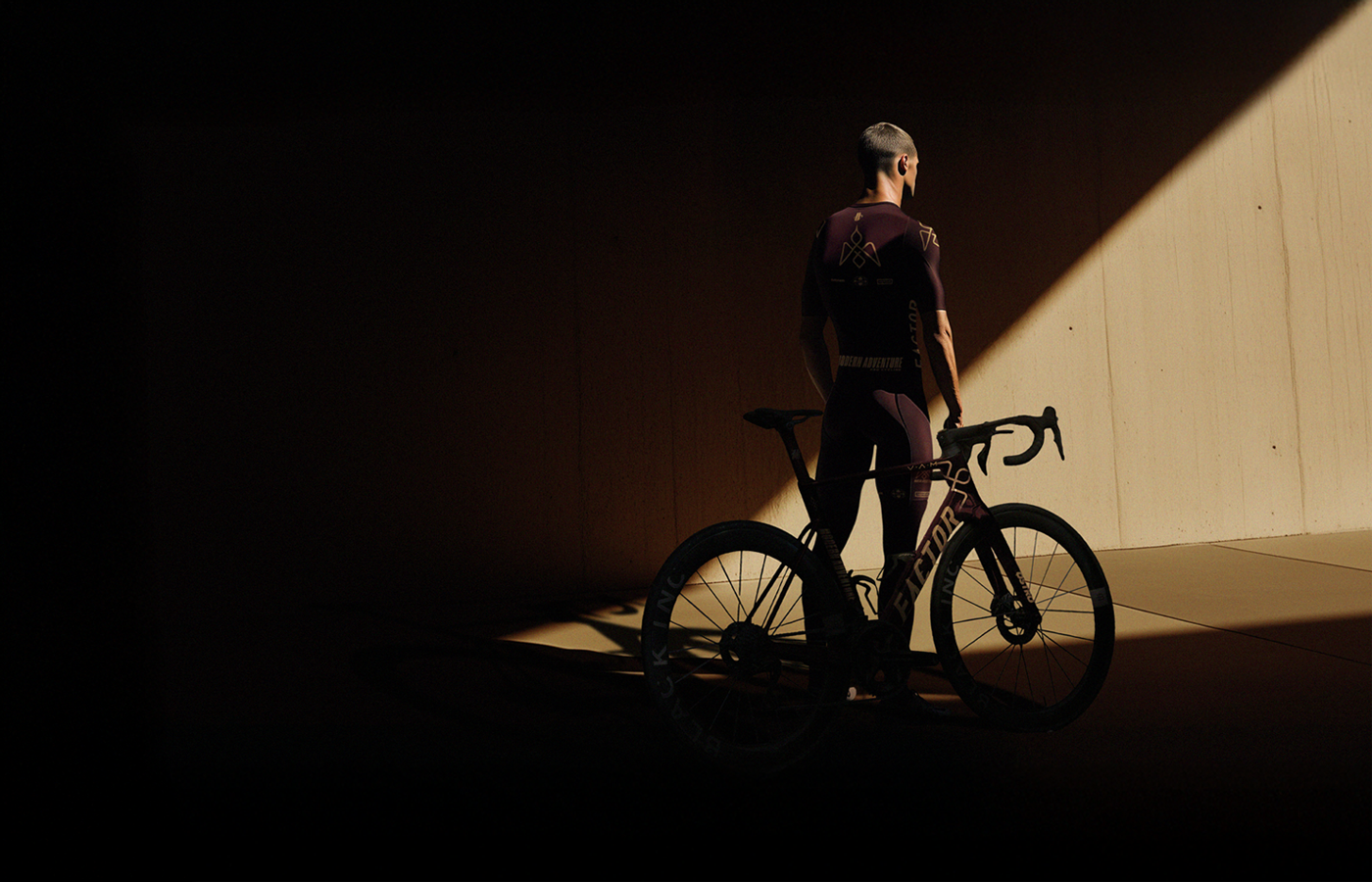 A rider in kit and a Factor bike for Modern Adventure Pro Cycling