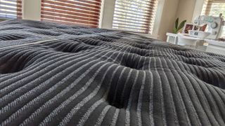 Close up of the top of the Beautyrest Black K-Class Plush Pillow Top mattress