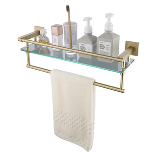 A gold and glass shelf and towel rack combo