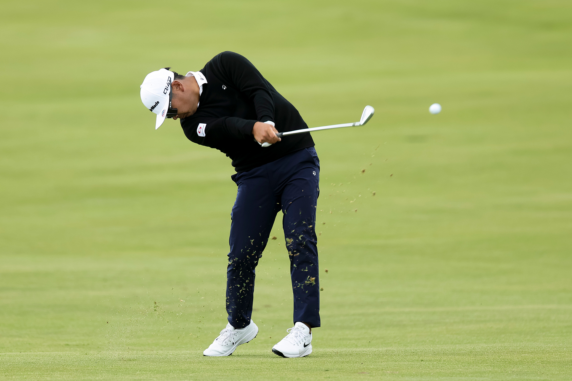 Ryo Hisatsune hitting a shot with an iron at the PGA Championship