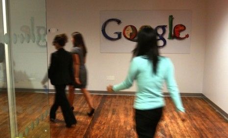 Employees walk down the hallway of the company&amp;#039;s Chelsea Market office in New York City. Google has recently opened offices in Pittsburgh and Hong Kong. 