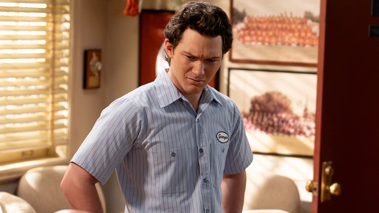 Georgie is upset in an office. 