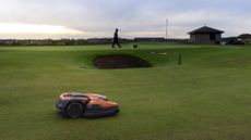 Robot mower on a golf course
