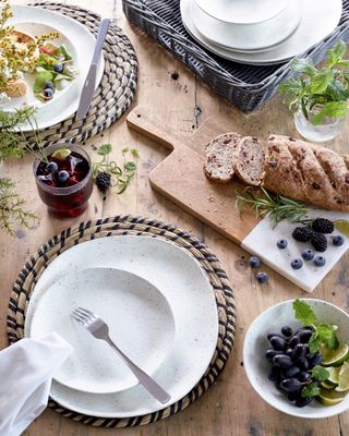 rustic table settings with wooden boards and woven mats