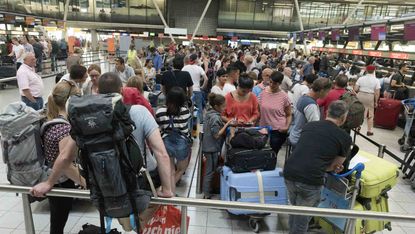 Brits queue at Schiphol Airport