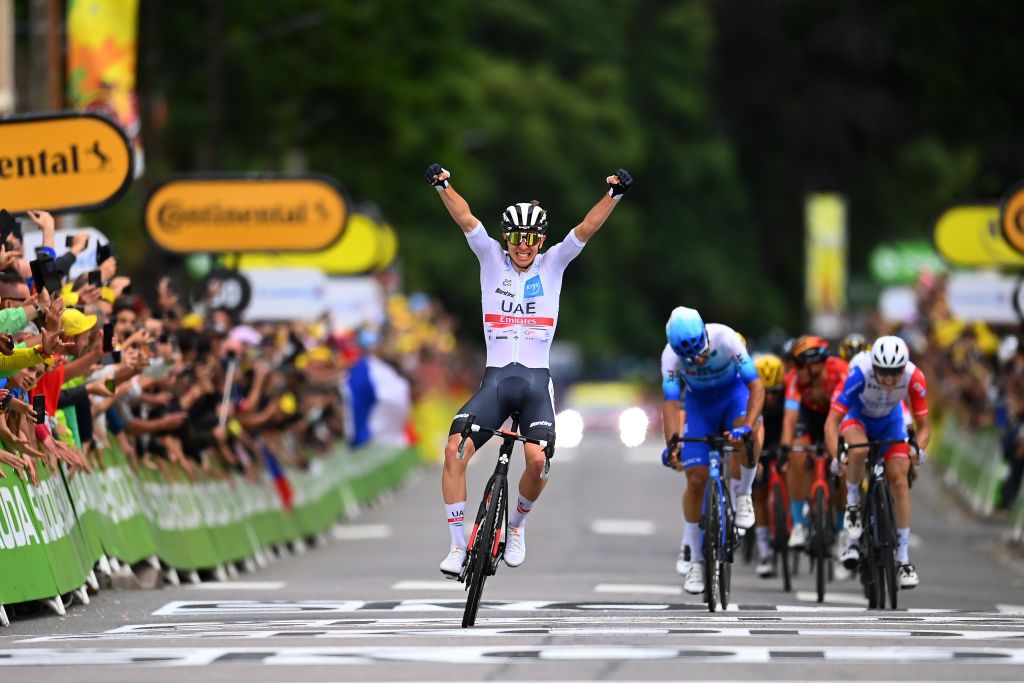 LONGWY FRANCE JULY 07 Tadej Pogacar of Slovenia and UAE Team Emirates white best young jersey celebrates winning ahead of Michael Matthews of Australia and Team BikeExchange Jayco and David Gaudu of France and Team Groupama FDJ during the 109th Tour de France 2022 Stage 6 a 2199km stage from Binche to Longwy 377m TDF2022 WorldTour on July 07 2022 in Longwy France Photo by Tim de WaeleGetty Images