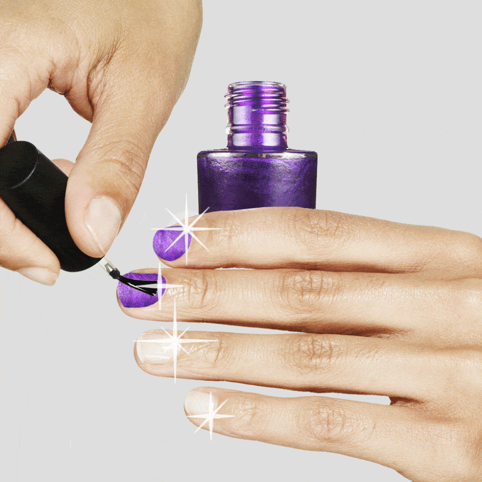 Painting on purple nail polish 
