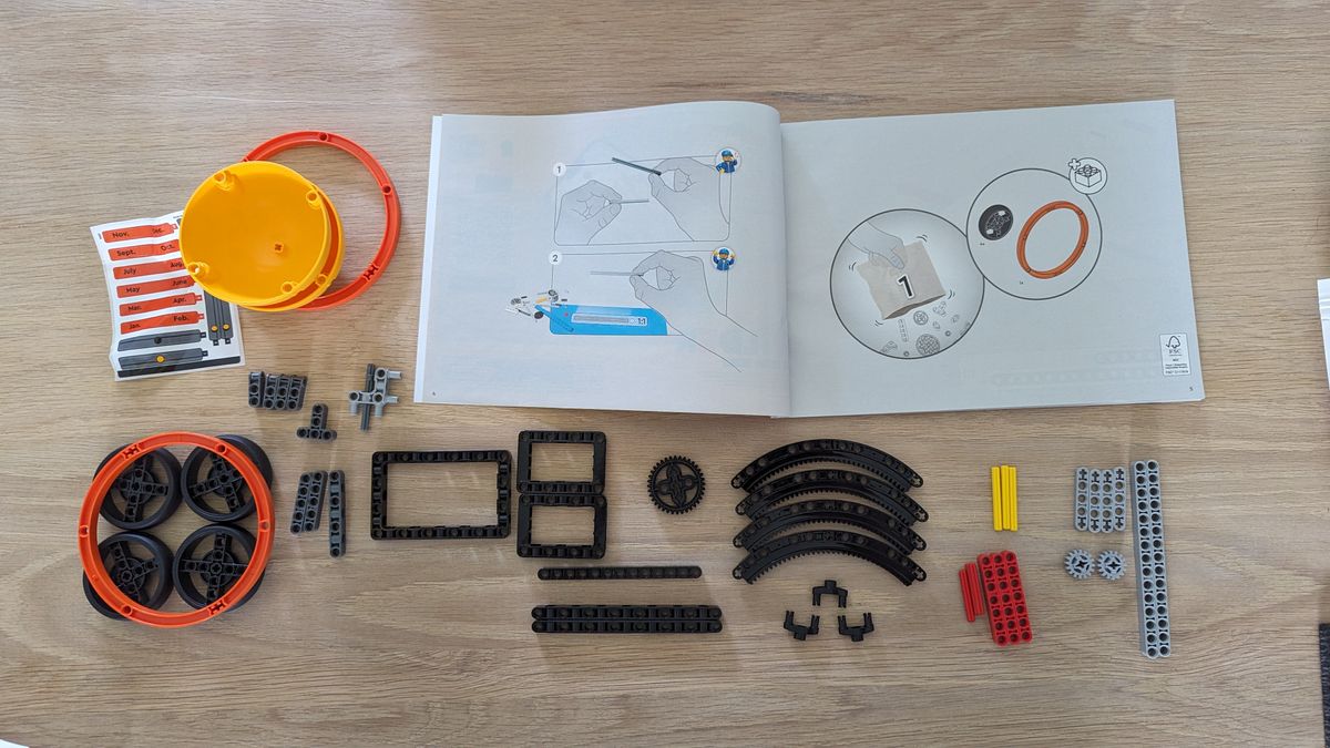 Lego technic planet earth and moon in orbit set on a white background