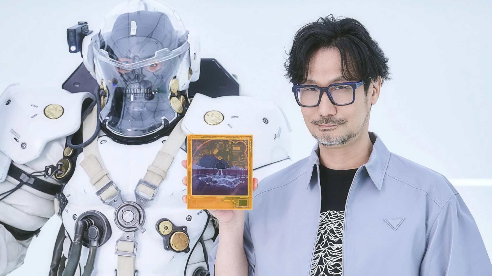 Hideo Kojima holding the limited edition Death Stranding CD player by km5 