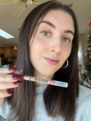 Marisa holding the Maybelline Build-A-Brow 2-In-1 Brow Pen and Sealing Gel