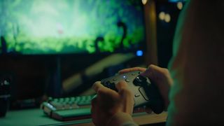 Someone using the Steam controller to play Hollow Knight