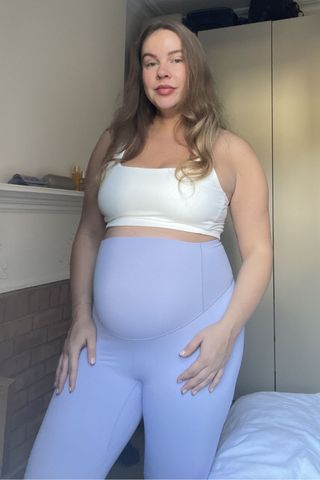 valeza wearing some of the FP Movement maternity workout clothes from the article