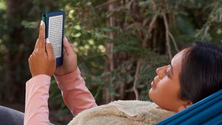 Amazon Kindle being read by a woman lying down