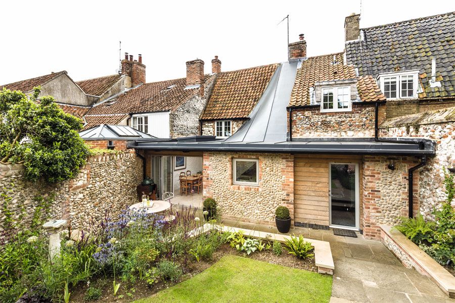 Renovated cottage with twisting roof