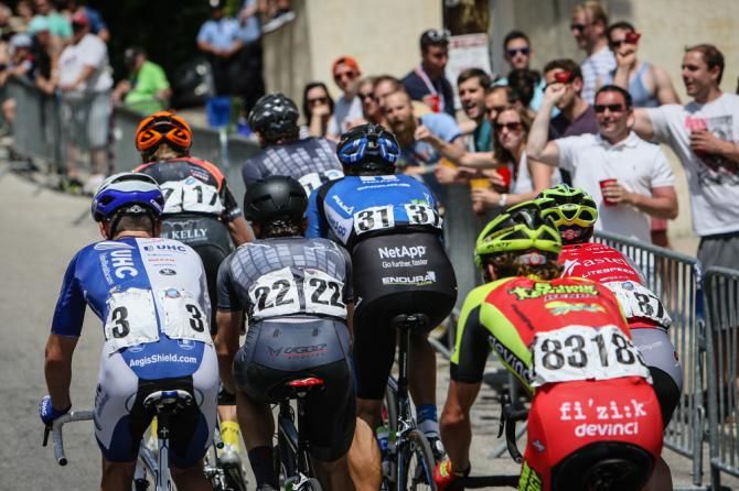 The breakaway gets cheered on by fans on the climb