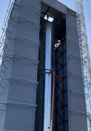 SpaceX's first Super Heavy booster for the company's Starship spacecraft is seen inside its assembly building at SpaceX's test facility near Boca Chica Village in South Texas.