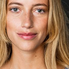 blonde woman with freckles on her face