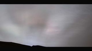 Sun rays of the setting sun seen scattering off clouds on Mars, captured by NASA's Curiosity rover.