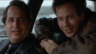 Jon Lovitz and Dana Carvey look at the camera with goofy expressions in Trapped in Paradise.