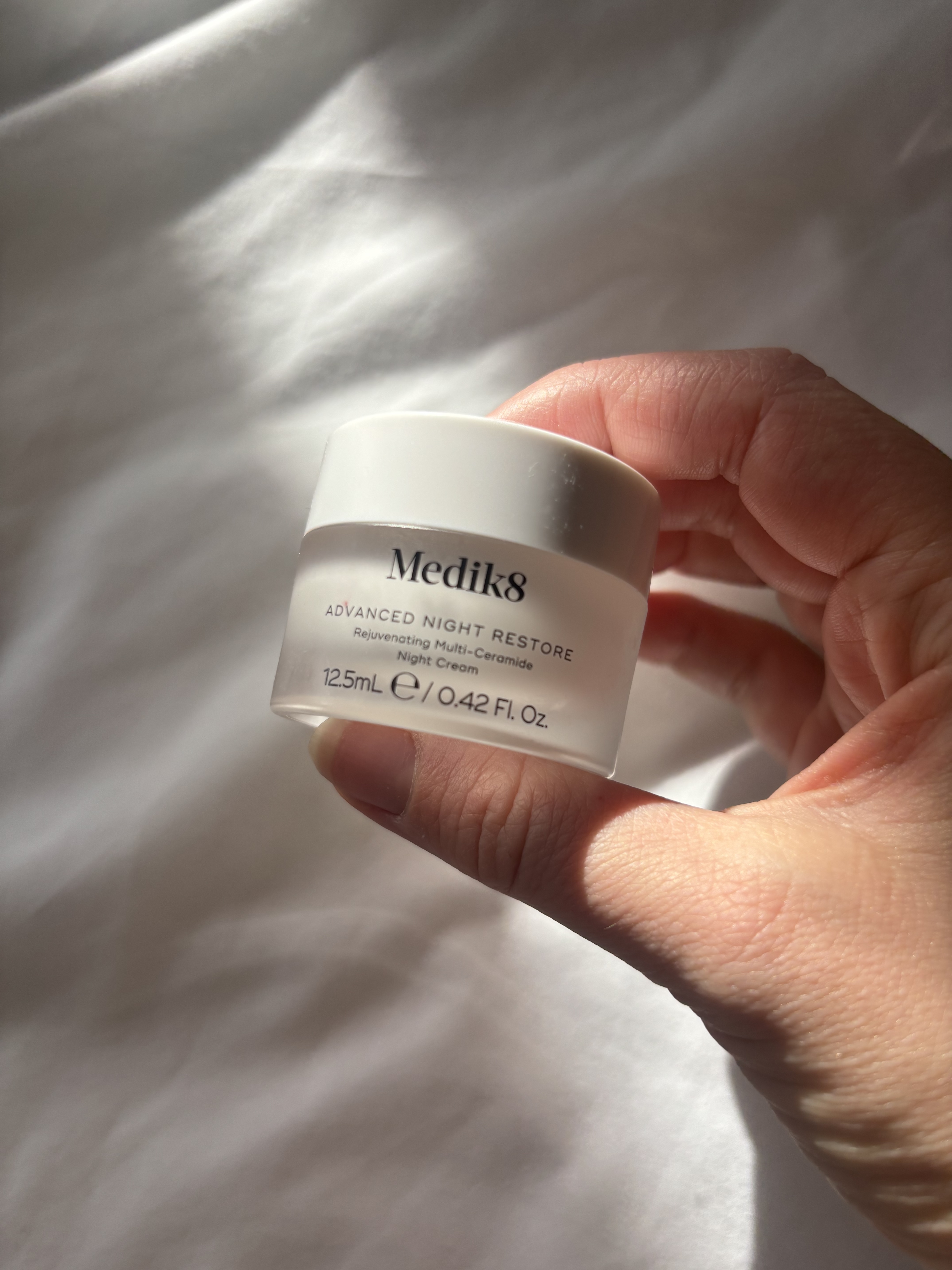 Perdita Nouril holding the Medik8 Advanced Night Restore