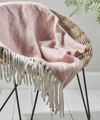 round wooden chair with pink cloth