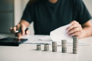 House calculator and coins