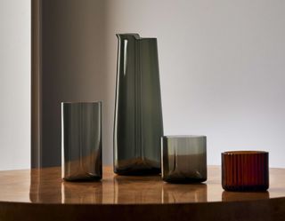Zaha Hadid Design Tableware: smoked glasses and carafe on table
