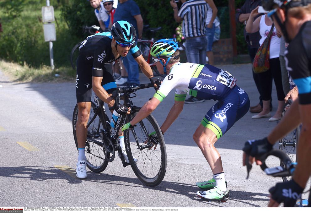 Simon Clarke gives Richie Porte his front wheel
