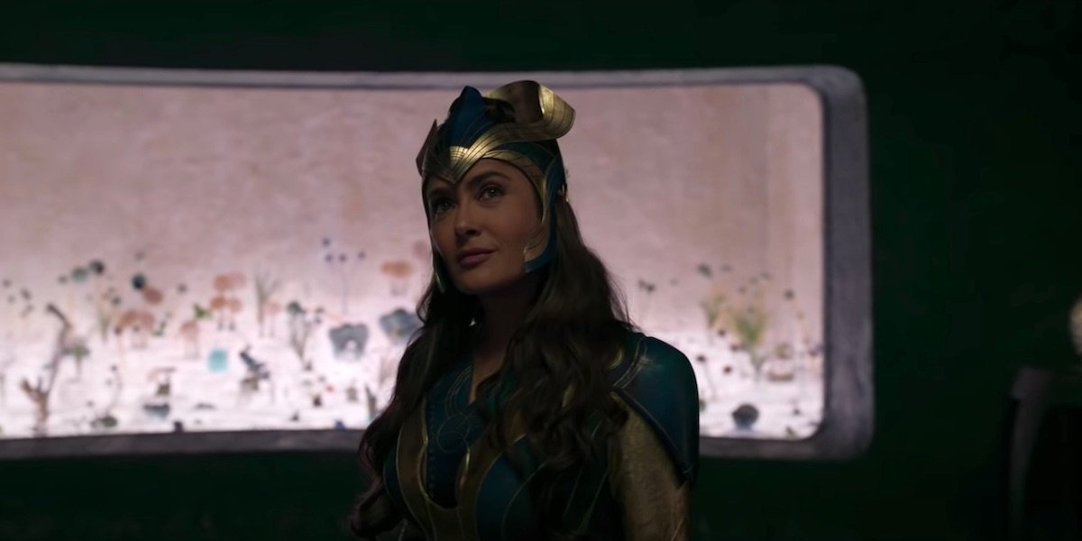 Salma Hayek looks up smiling, in full costume in Marvel&#039;s Eternals.