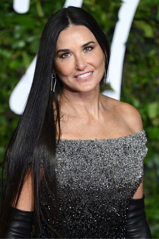 Demi Moore - with long black hair - attends The Fashion Awards 2021 at the Royal Albert Hall on November 29, 2021 in London, England.