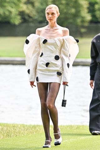 models walks the runway during "Le Chouchou" Jacquemus' Fashion Show at Chateau de Versailles on June 26, 2023 in Versailles, France.
